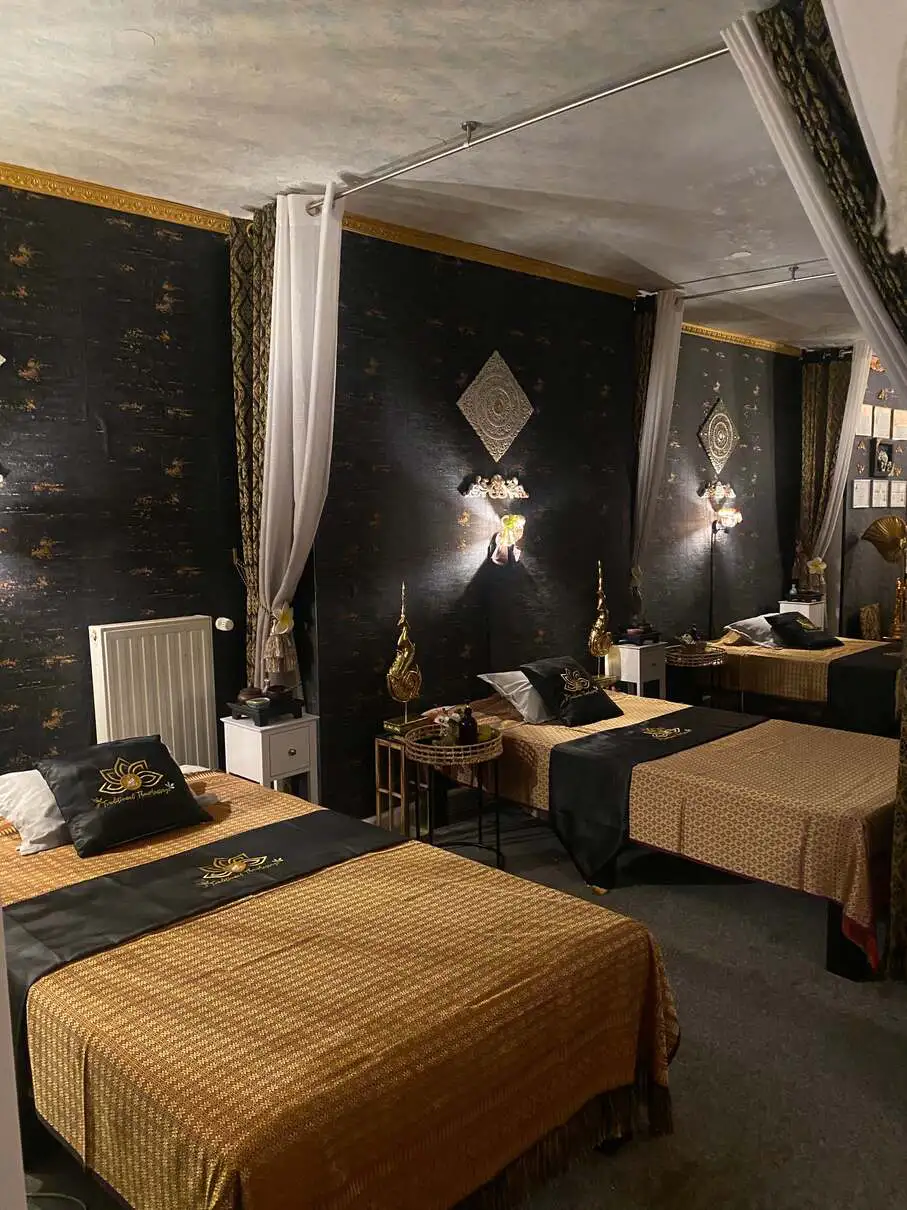 Harmoniously designed corridor with traditional massage beds